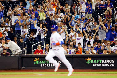 ny met pete alonso rounds the bases in front of a cheering home crowd