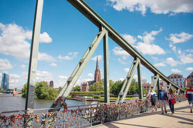 people walking along eiserner steg bridge