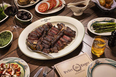 steak and a full table at peter luger in caesars palace las vegas