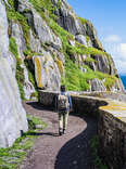 woman exploring skellig michael, county kerry, ireland